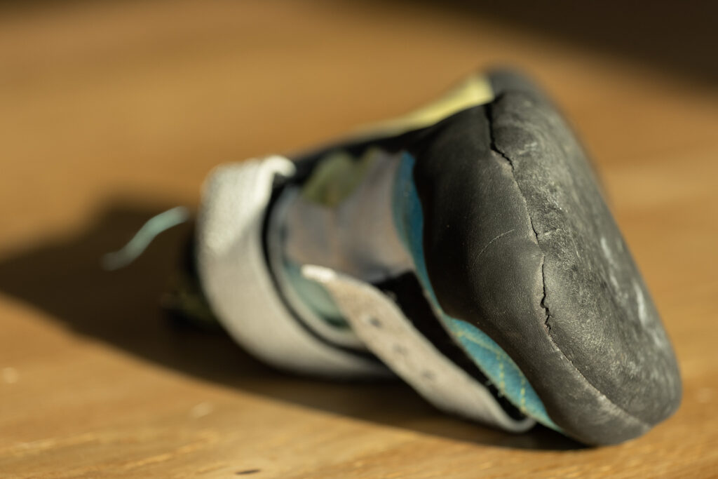 A worn climbing shoe before repair